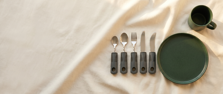 The Everhold Collection — weighted easy-grip tableware on cream linen